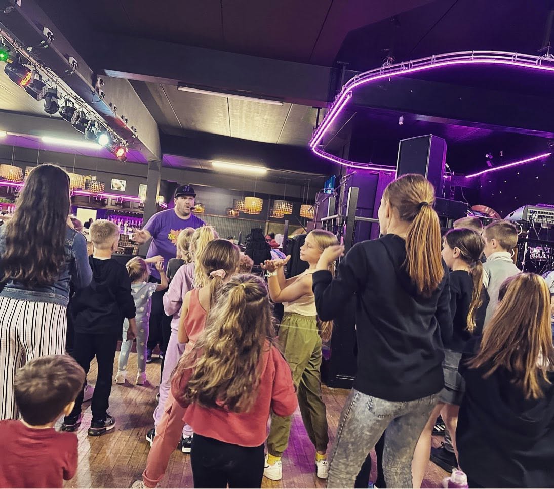 JJ leading a mini disco for kids near Peterborough
