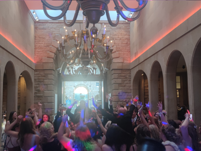 JJ DJing at a Bass Beats Disco event with colourful lighting