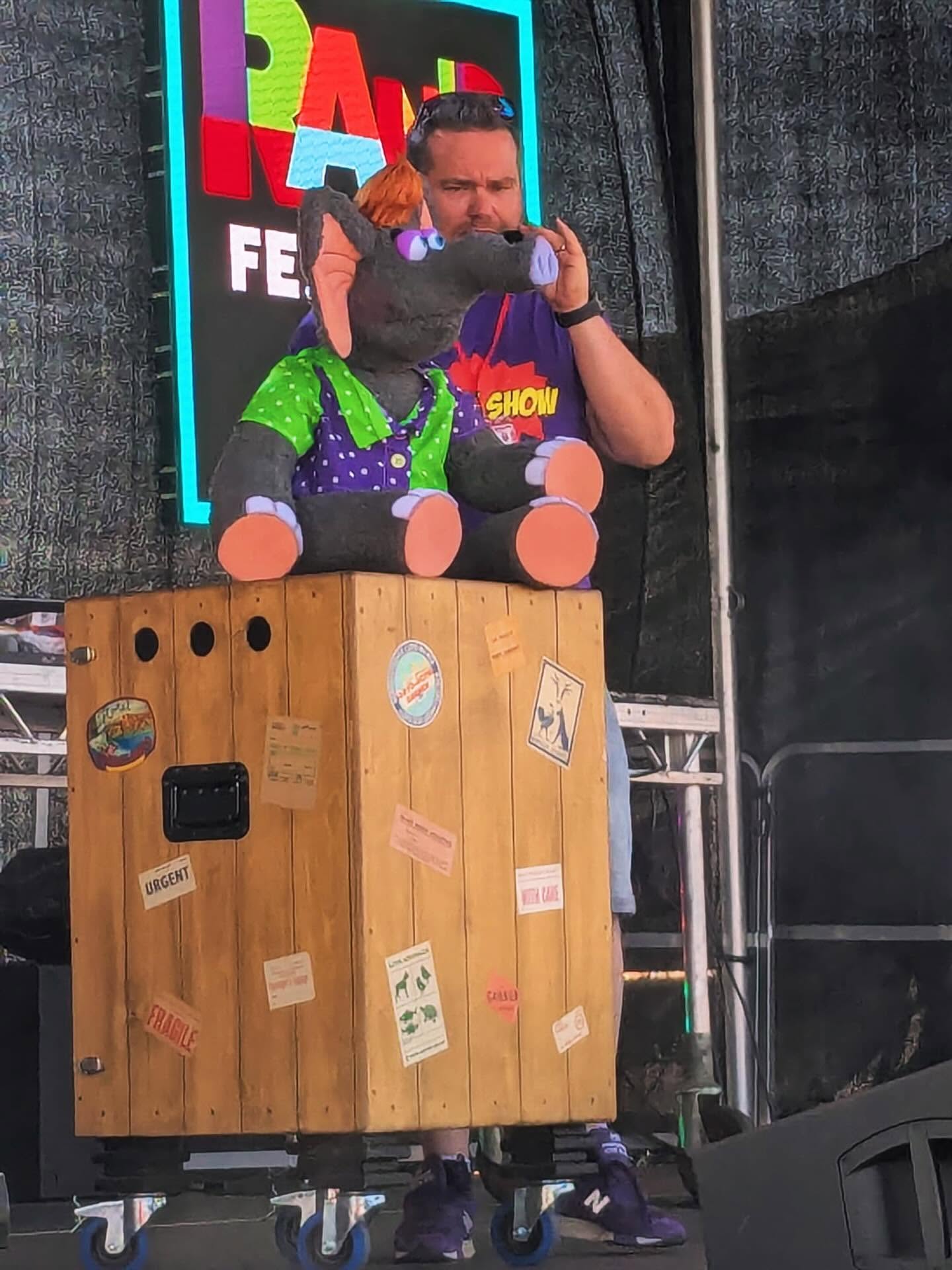 Donut the elephant on stage at a family festival